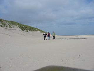 Sand mit Touristen